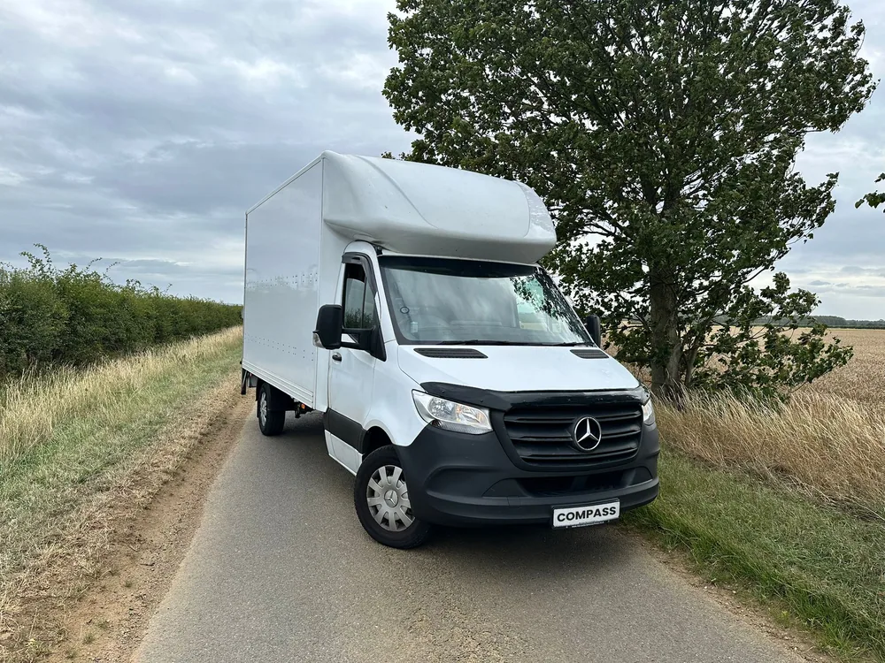 Compass Cargo truck on a rural delivery road