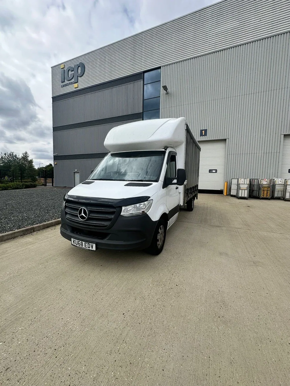 Compass Cargo vehicle outside a logistics warehouse