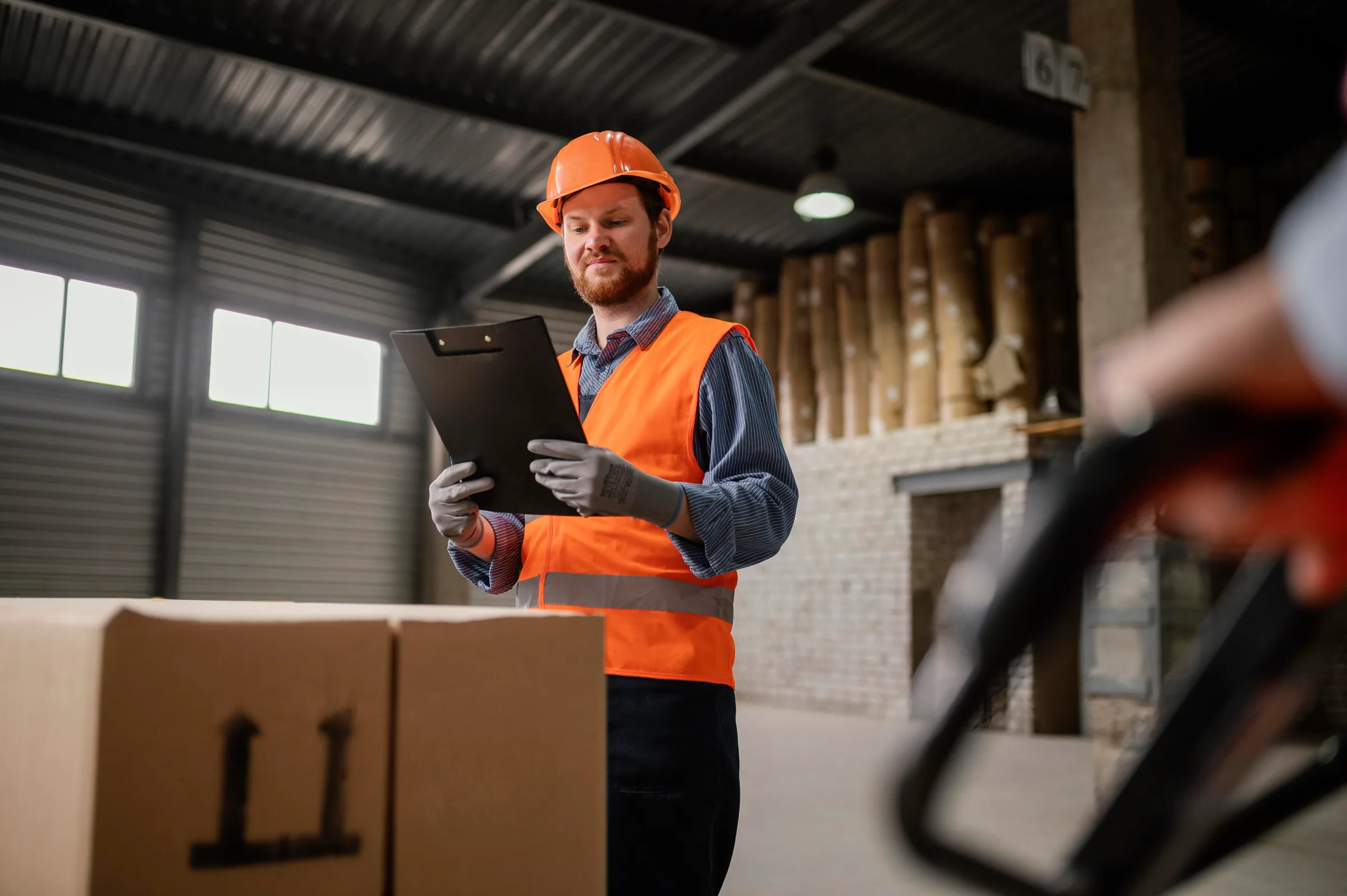 Warehouse worker checking cargo and handling operations